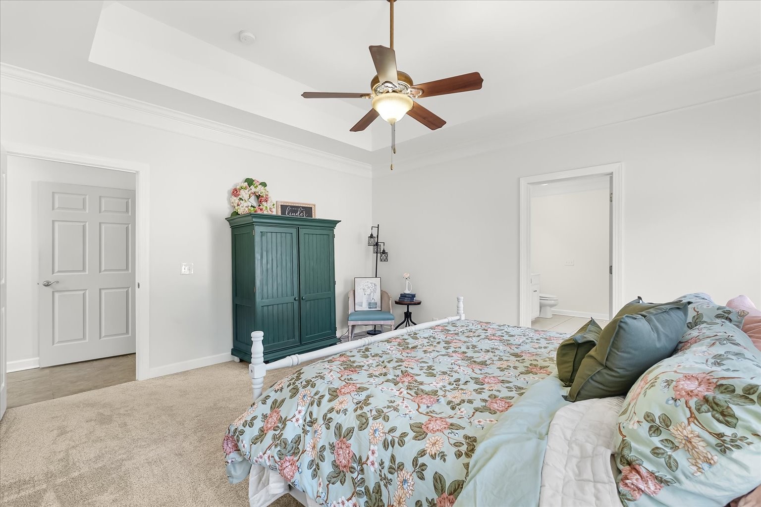 140 Glider Loop Eagleville, TN 37060 - Photo 22 of 39 a bedroom with a bed and a chandelier