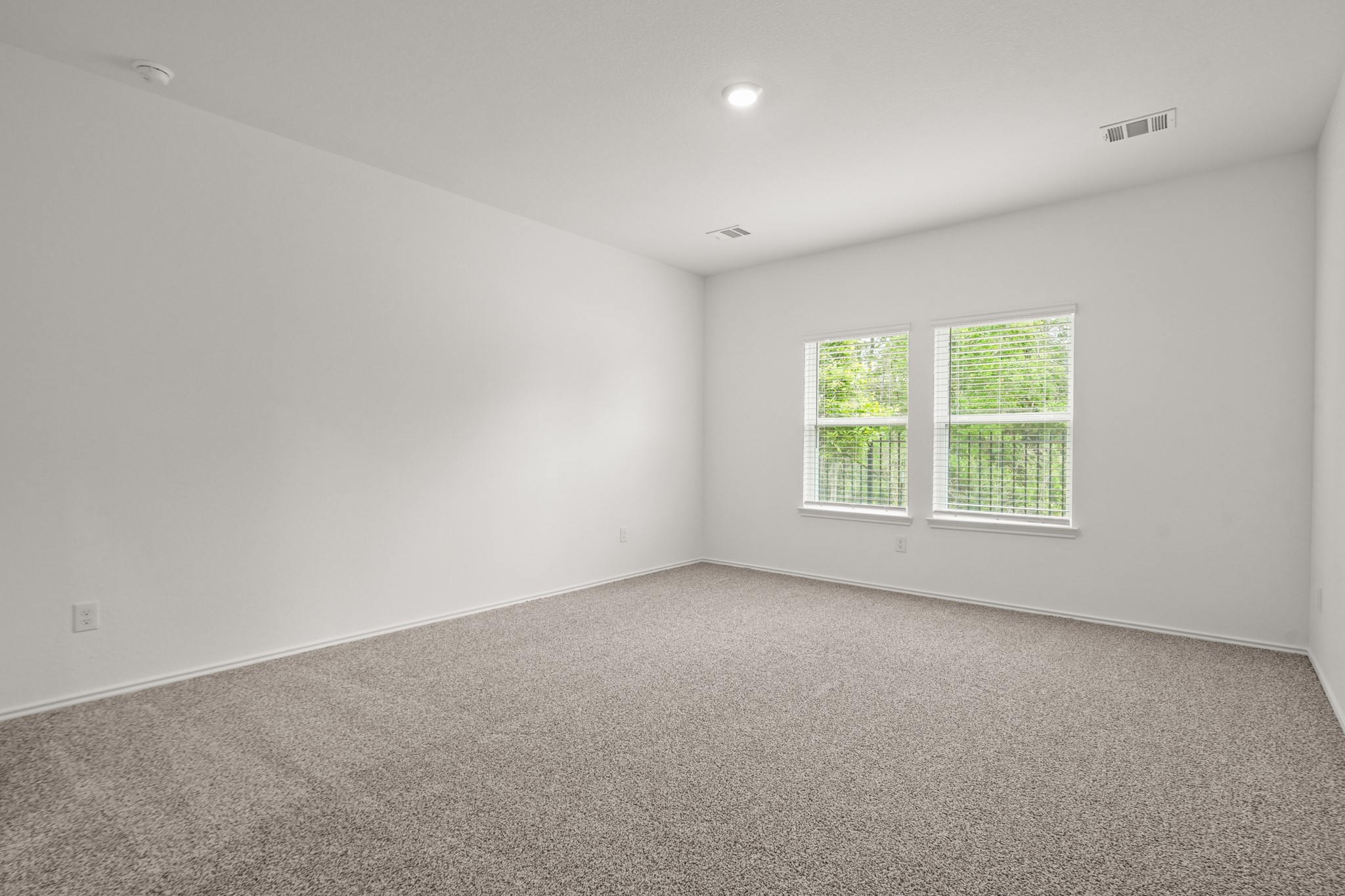 543 Belle Spgs Lane Conroe, TX 77301 - Photo 10 of 19 an empty room with windows