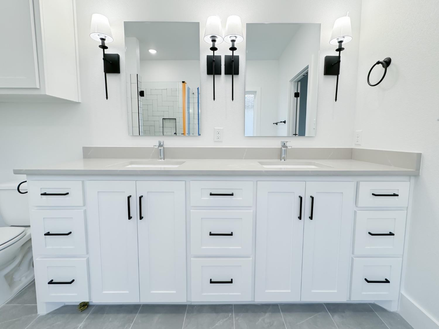 1301 Abbey Road Wolfforth, TX 79382 - Photo 14 of 24 a bathroom with a double vanity sink mirror and