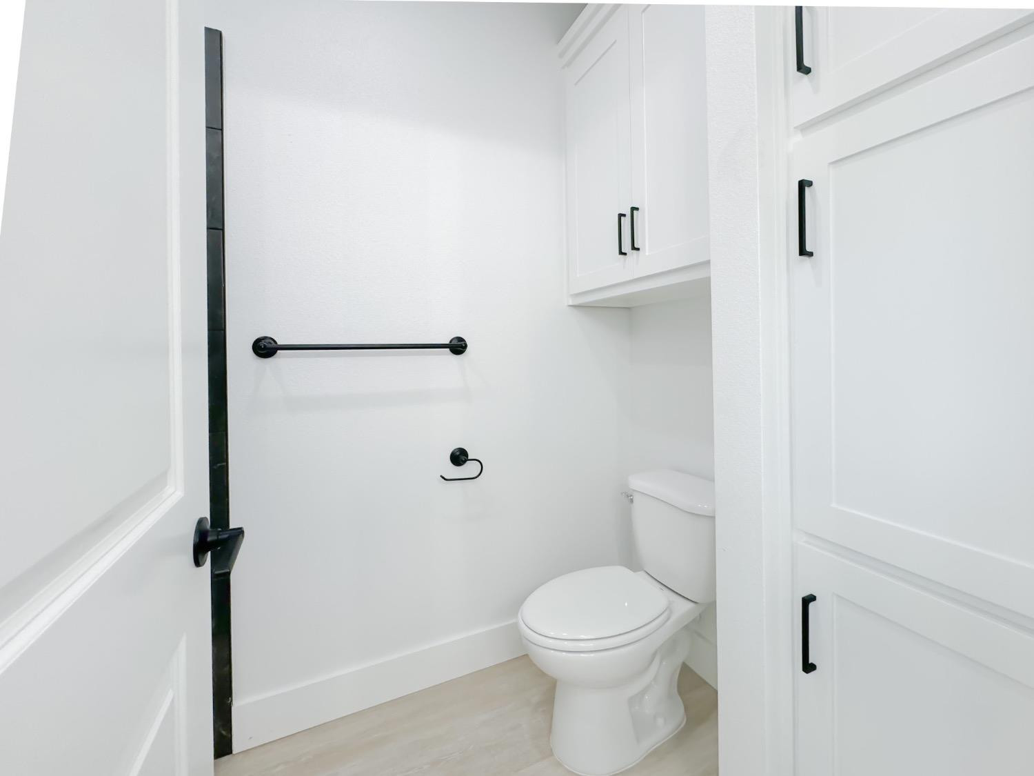 1301 Abbey Road Wolfforth, TX 79382 - Photo 22 of 24 a bathroom with a toilet and a shower
