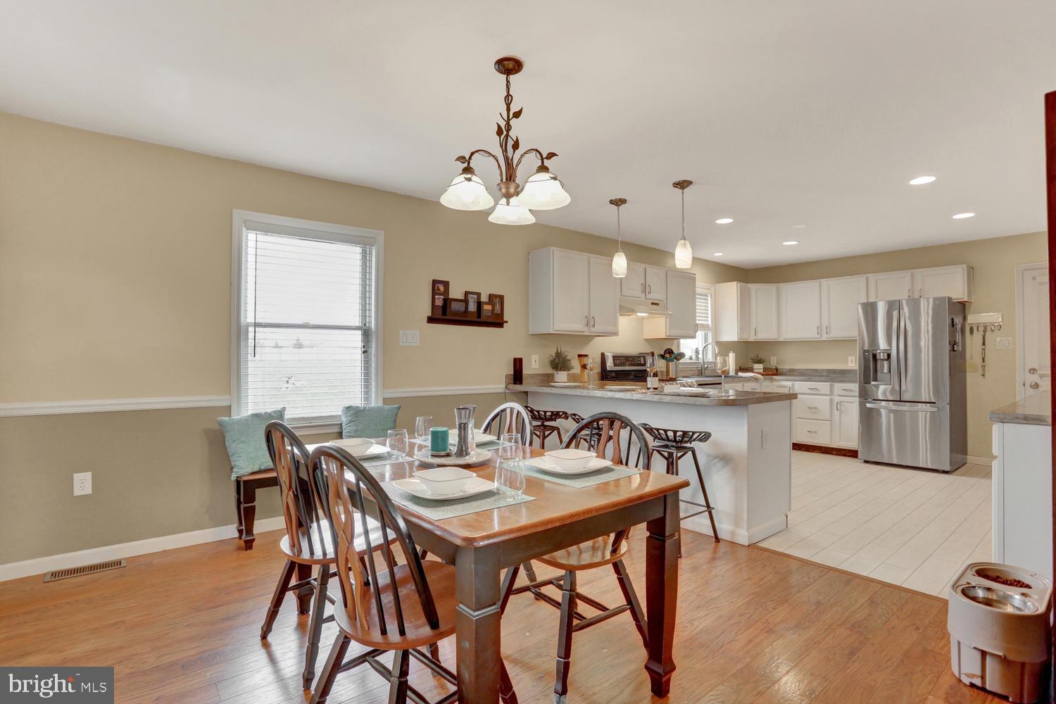 240 Mud College Road Littlestown, PA 17340 - Photo 7 of 36 Chair rail, laminate floors and fresh paint, ...
