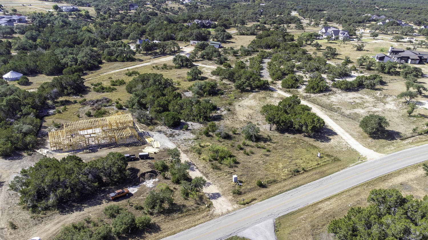 2251 West Fitzhugh Road Dripping Springs, TX 78620 - Photo 5 of 16 a view of a yard with wooden fence