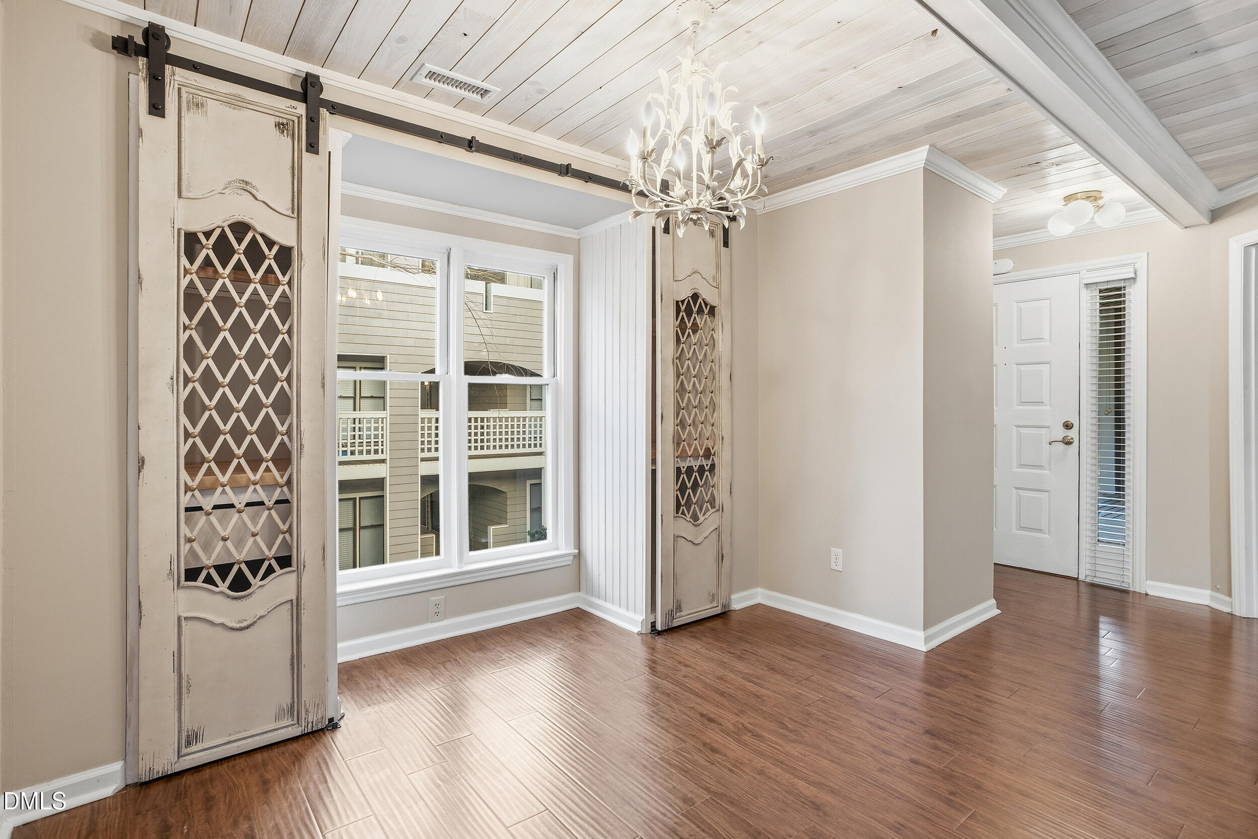 730 Washington Street, Unit 205 Raleigh, NC 27605 - Photo 11 of 23 wooden floor in an empty room with a window