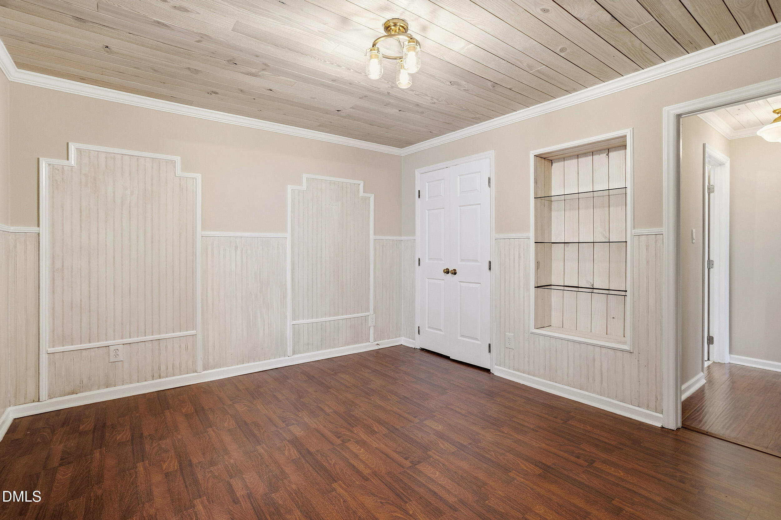 730 Washington Street, Unit 205 Raleigh, NC 27605 - Photo 16 of 23 an empty room with wooden floor cabinet and windows