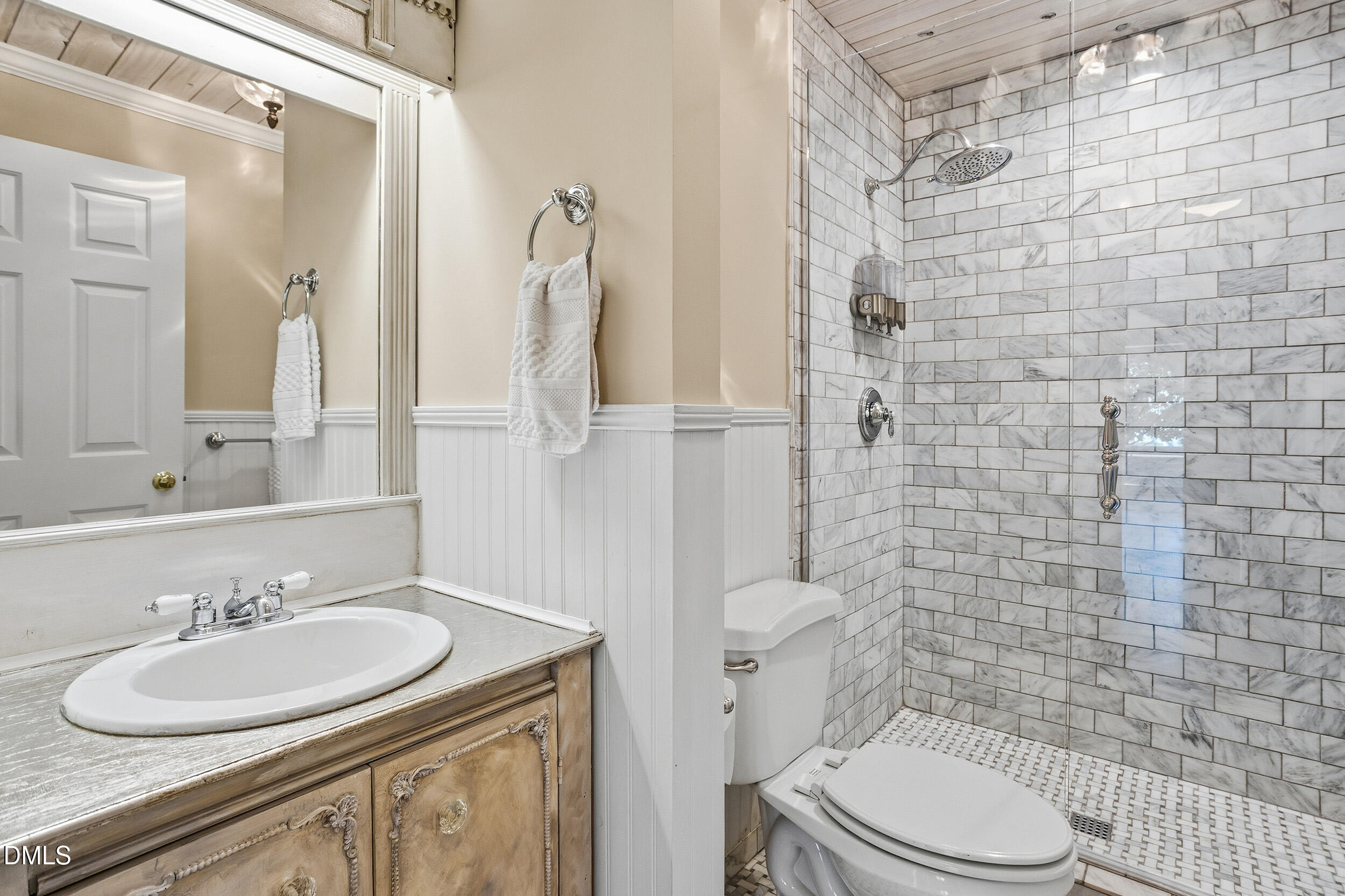 730 Washington Street, Unit 205 Raleigh, NC 27605 - Photo 18 of 23 a bathroom with a sink a toilet and shower