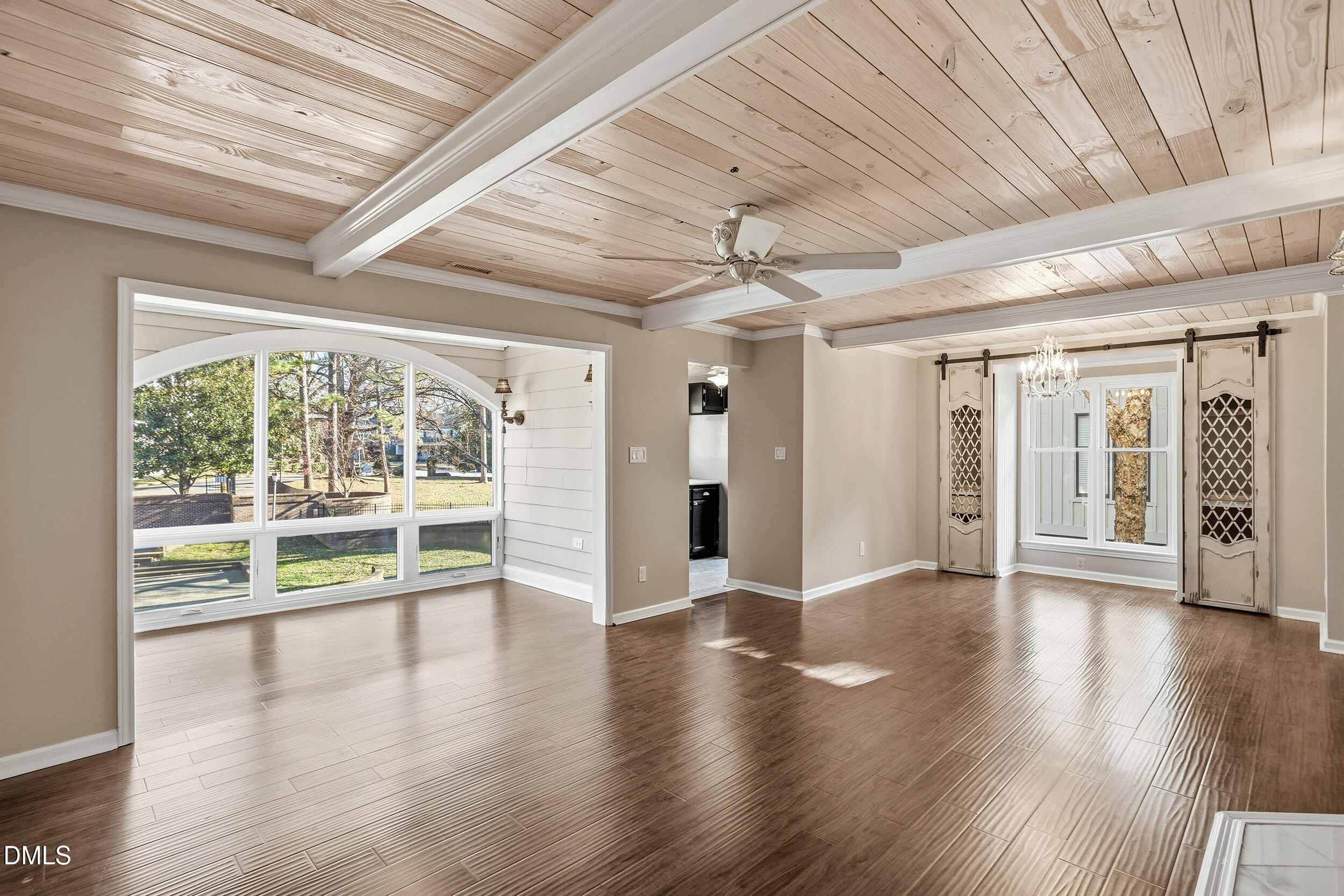 730 Washington Street, Unit 205 Raleigh, NC 27605 - Photo 2 of 23 a view of an empty room with wooden floor and a window