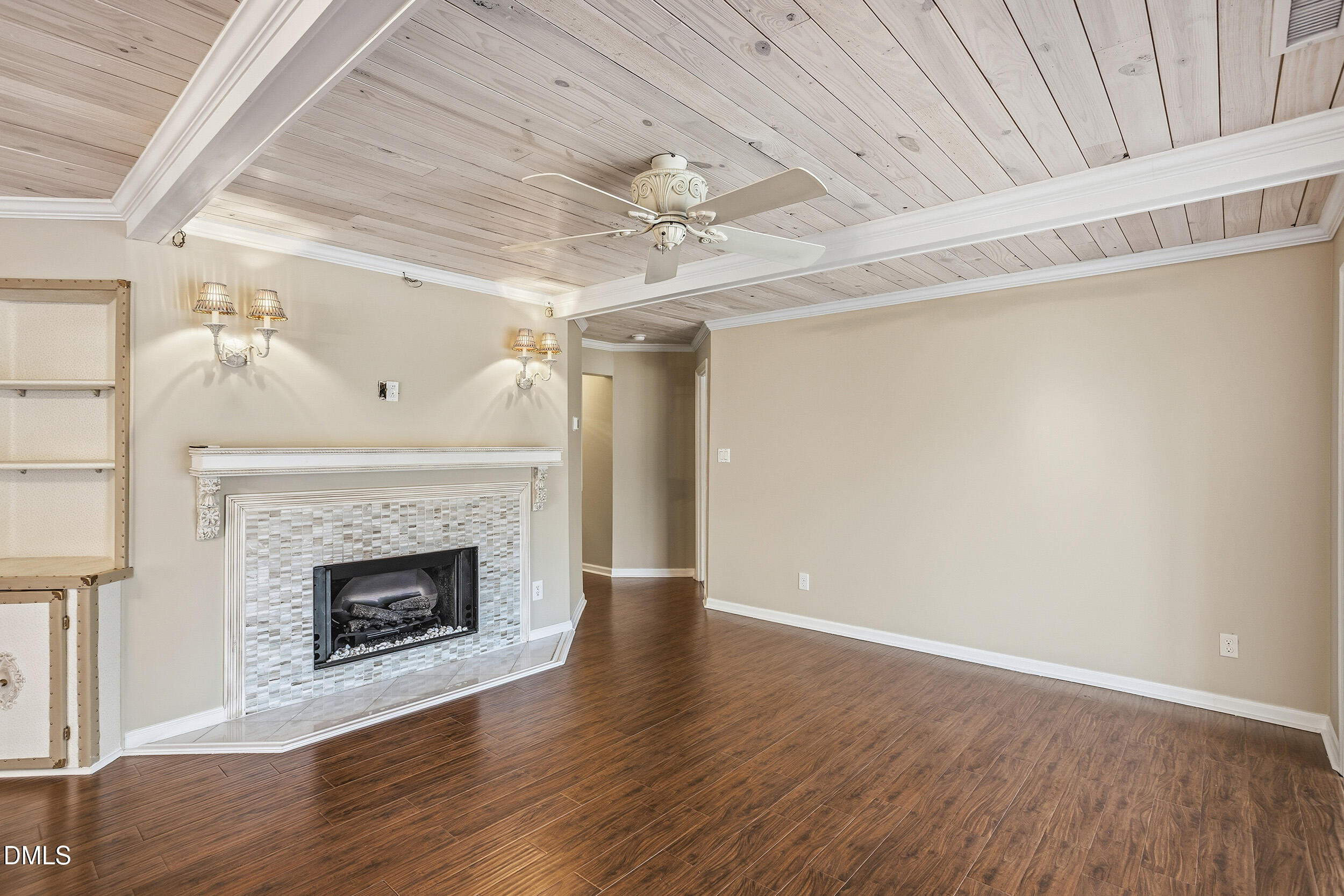 730 Washington Street, Unit 205 Raleigh, NC 27605 - Photo 5 of 23 a view of an empty room with wooden floor fireplace and a window