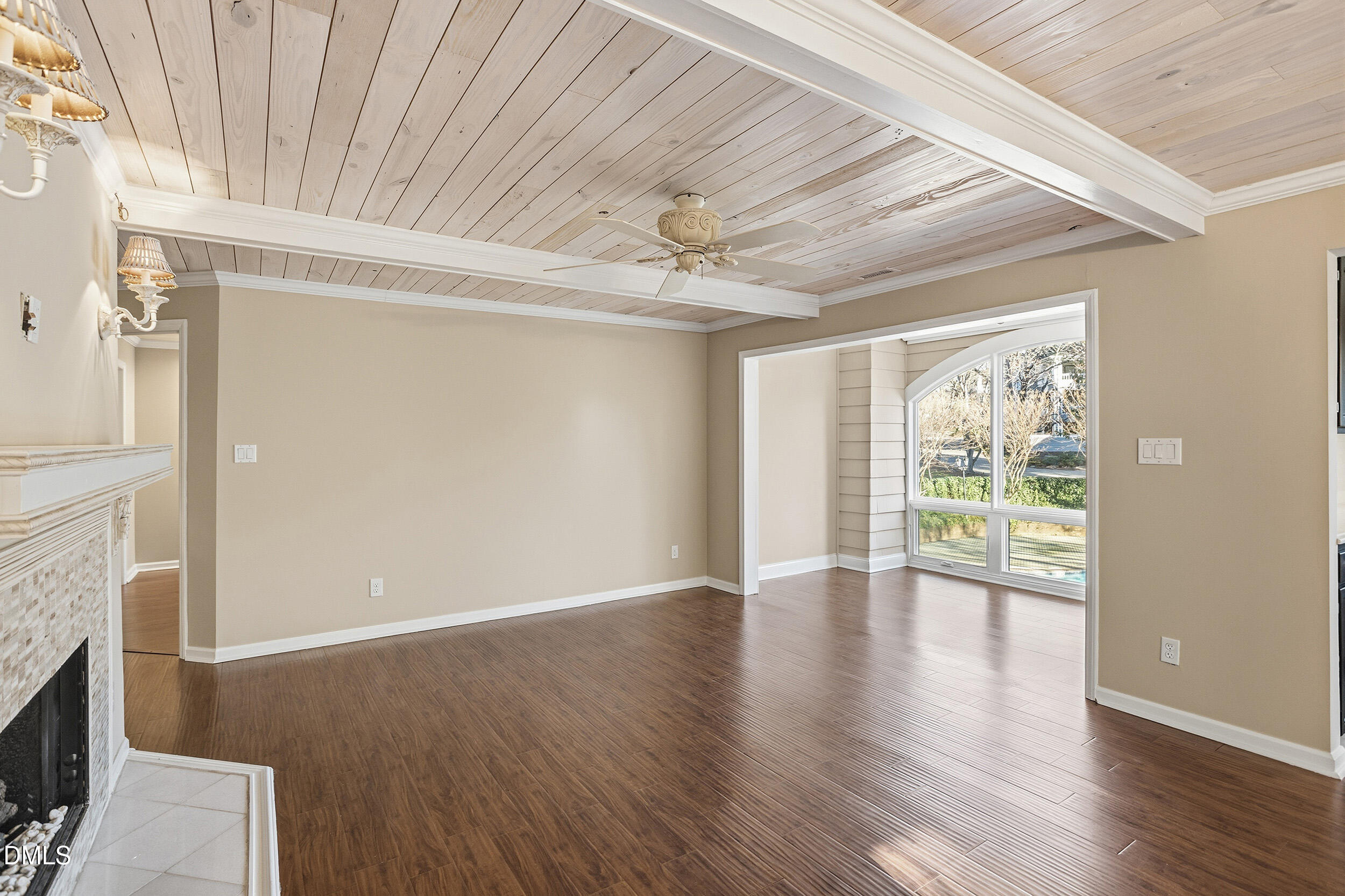 730 Washington Street, Unit 205 Raleigh, NC 27605 - Photo 6 of 23 a view of an empty room with wooden floor and a window