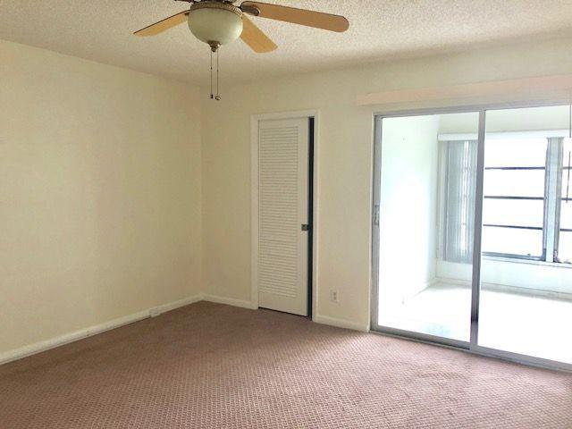 2022 Wolverton East, Unit 2022 Boca Raton, FL 33434 - Photo 5 of 21 an empty room with a window