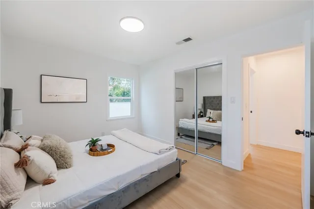 a bedroom with a bed and a table