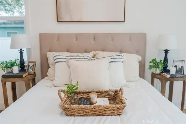 a dining room with furniture and potted plants