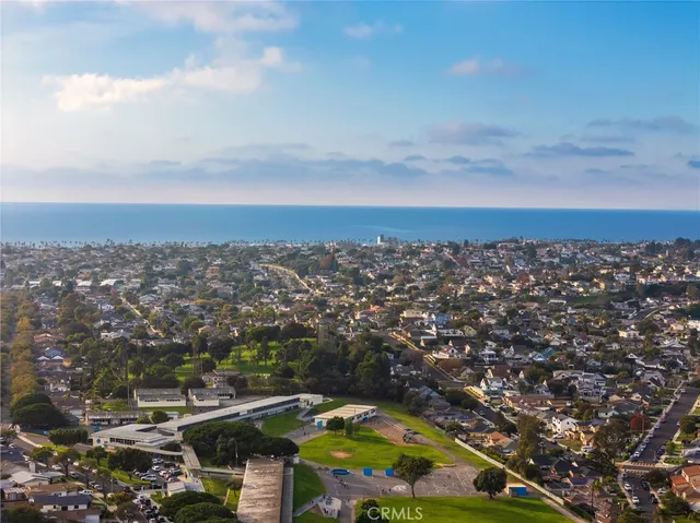 an aerial view of residential building and car parked