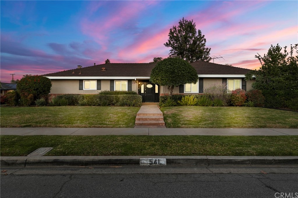 541 Juniper Street Brea, CA 92821 - Photo 1 of 1 a front view of a house with a yard
