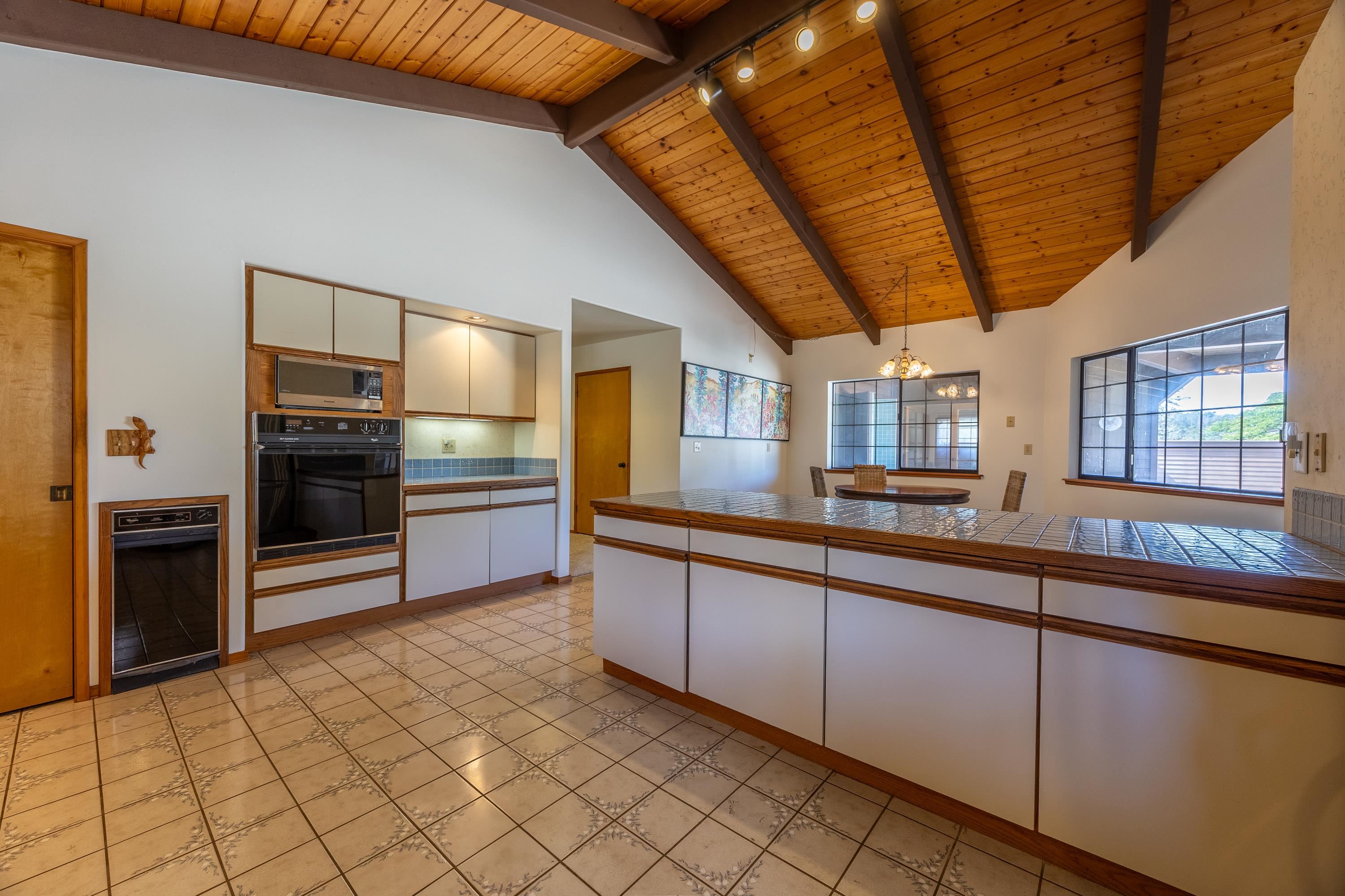 128 Hoopalua Drive Makawao, HI 96768 - Photo 17 of 50 a kitchen with stainless steel appliances granite countertop a refrigerator and a sink