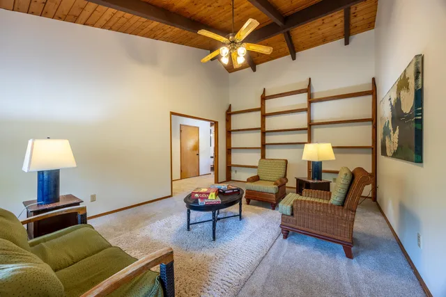 a living room with furniture and a lamp