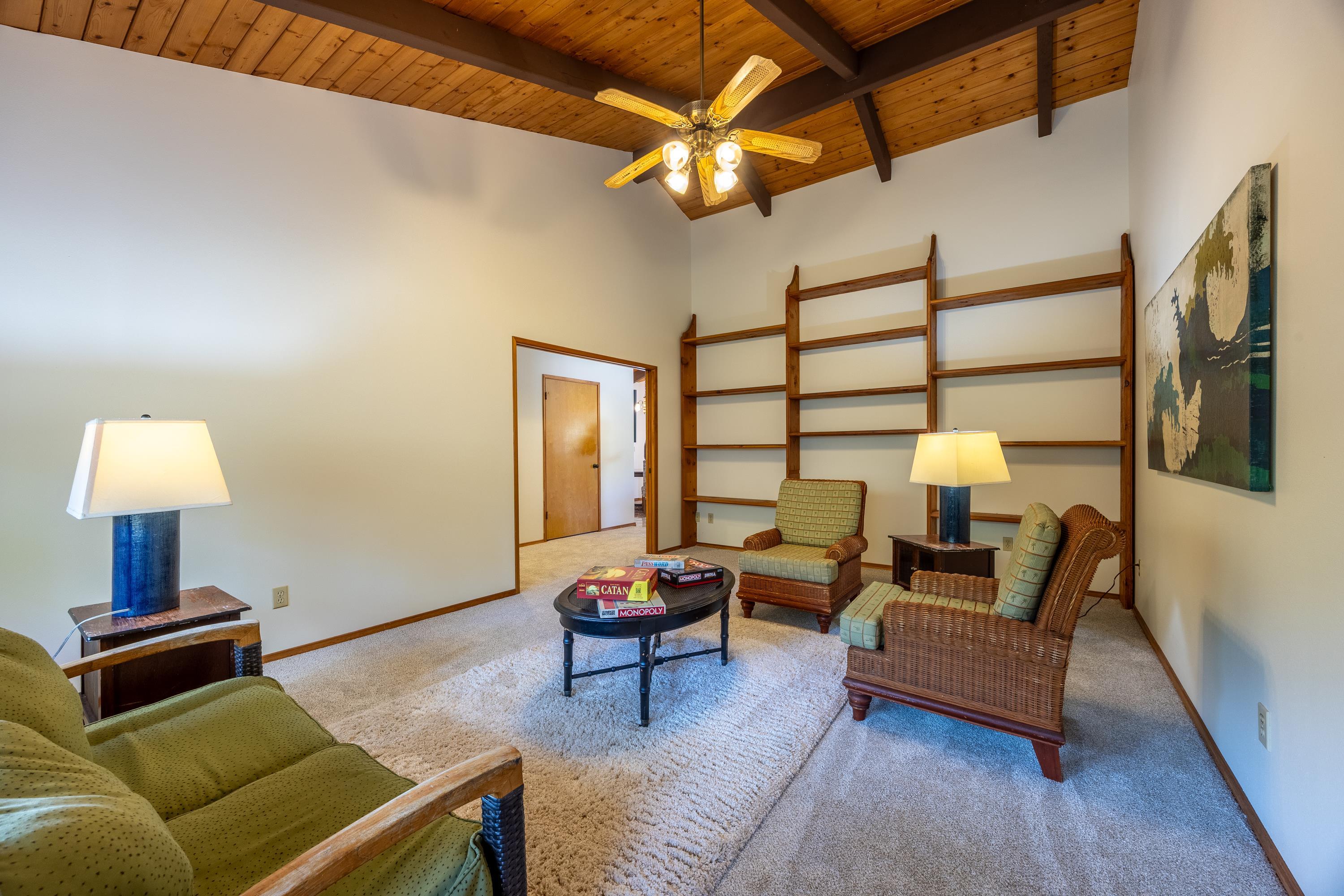 128 Hoopalua Drive Makawao, HI 96768 - Photo 19 of 50 a living room with furniture and a lamp