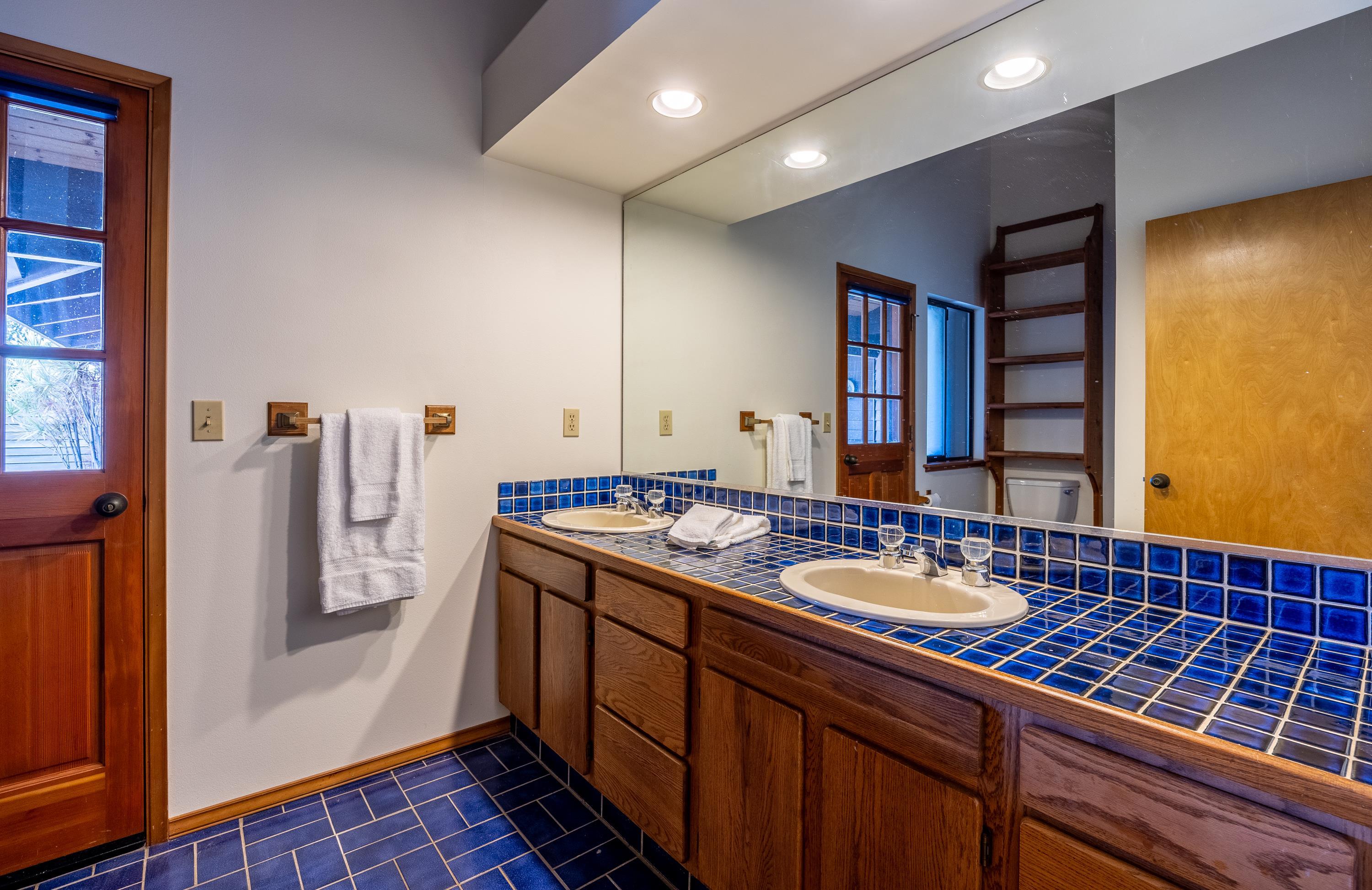 128 Hoopalua Drive Makawao, HI 96768 - Photo 21 of 50 a bathroom with a sink and a mirror