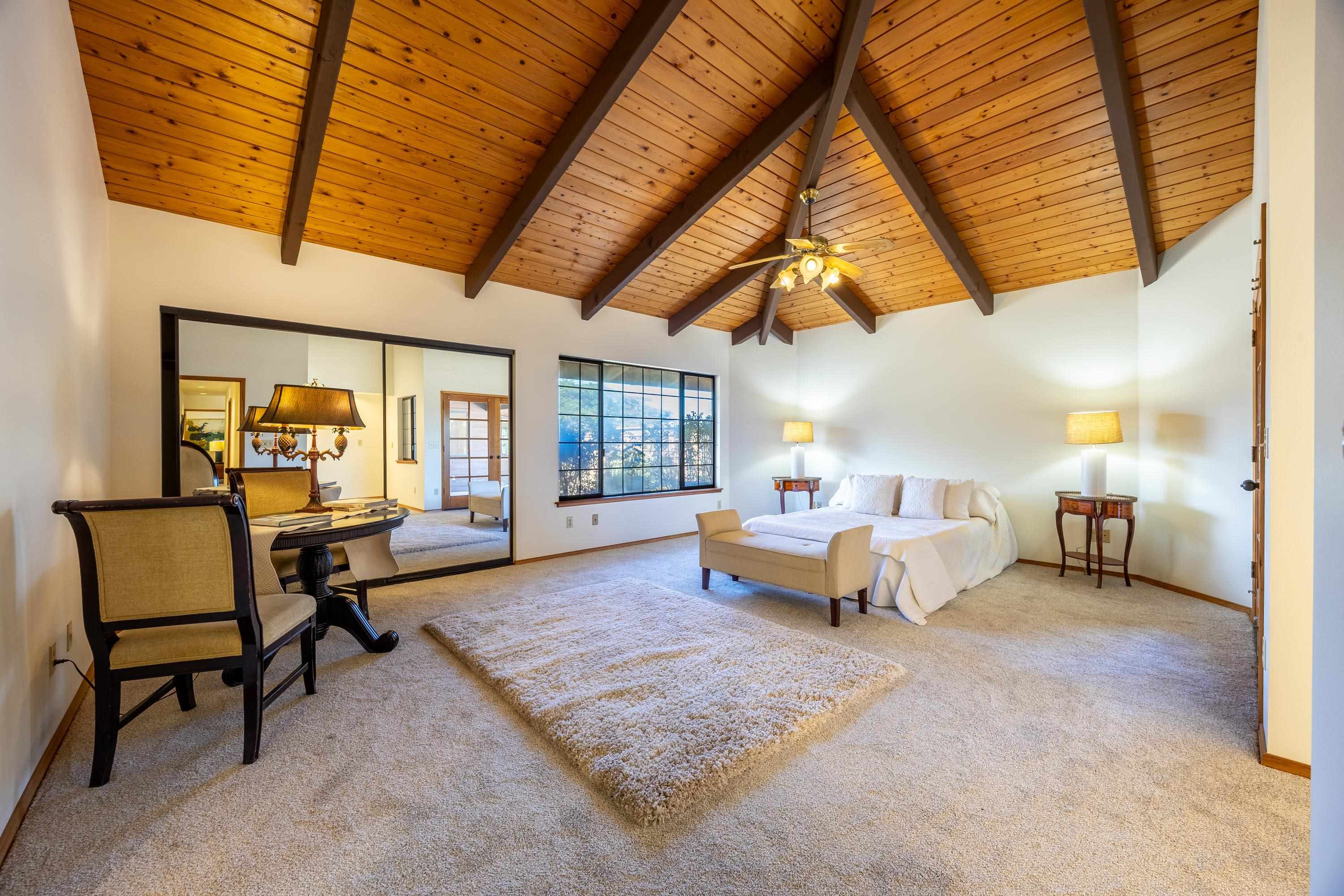 128 Hoopalua Drive Makawao, HI 96768 - Photo 26 of 50 a living room with furniture a couch and next to a window