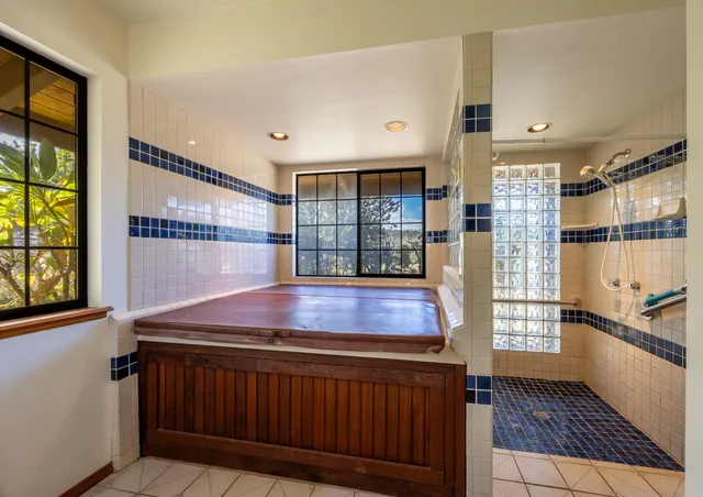 a kitchen with stainless steel appliances granite countertop a stove and a refrigerator