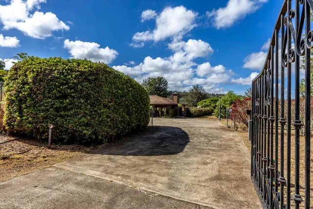 a view of a yard with an outdoor space