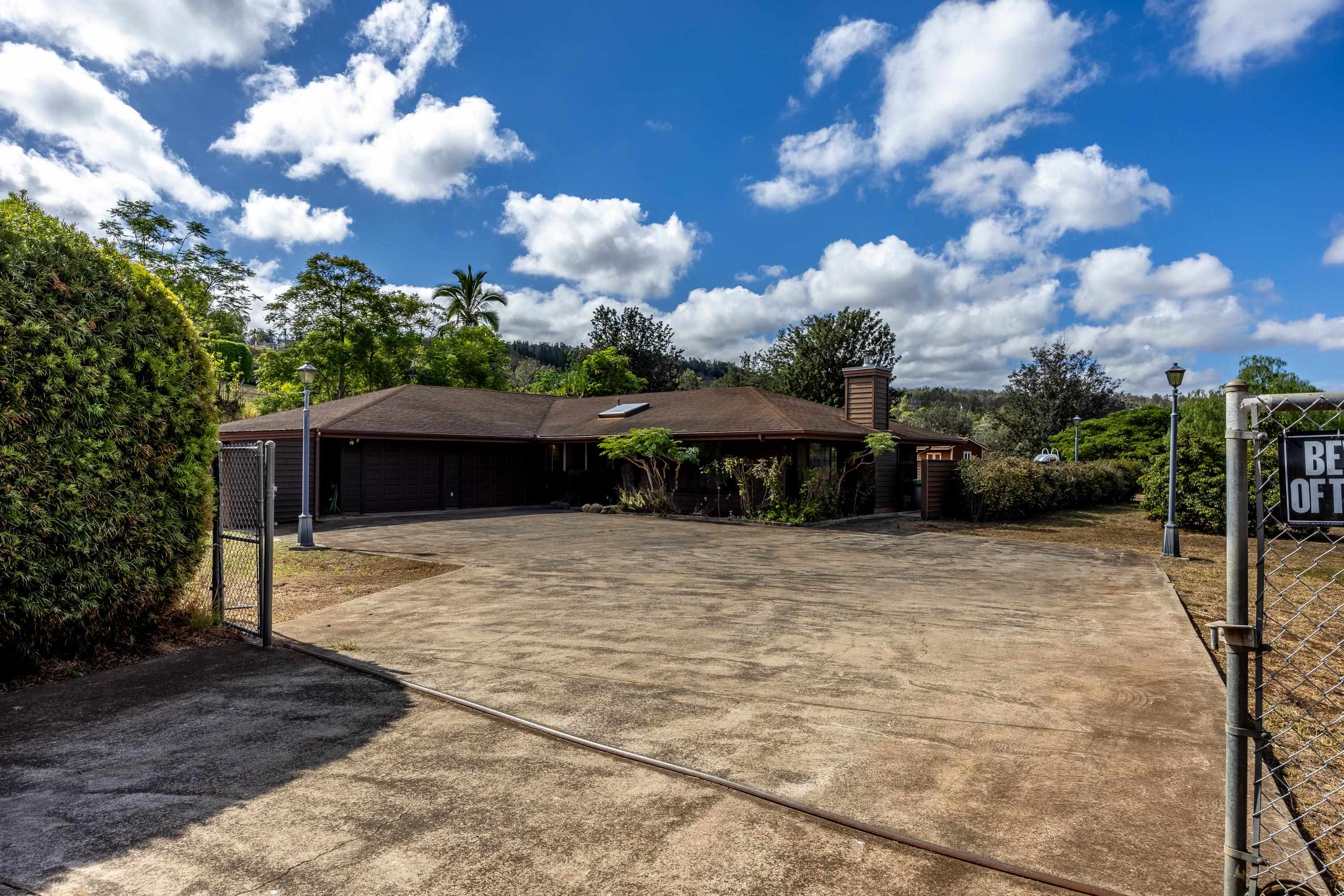 128 Hoopalua Drive Makawao, HI 96768 - Photo 44 of 50 a view of a house with backyard and garden