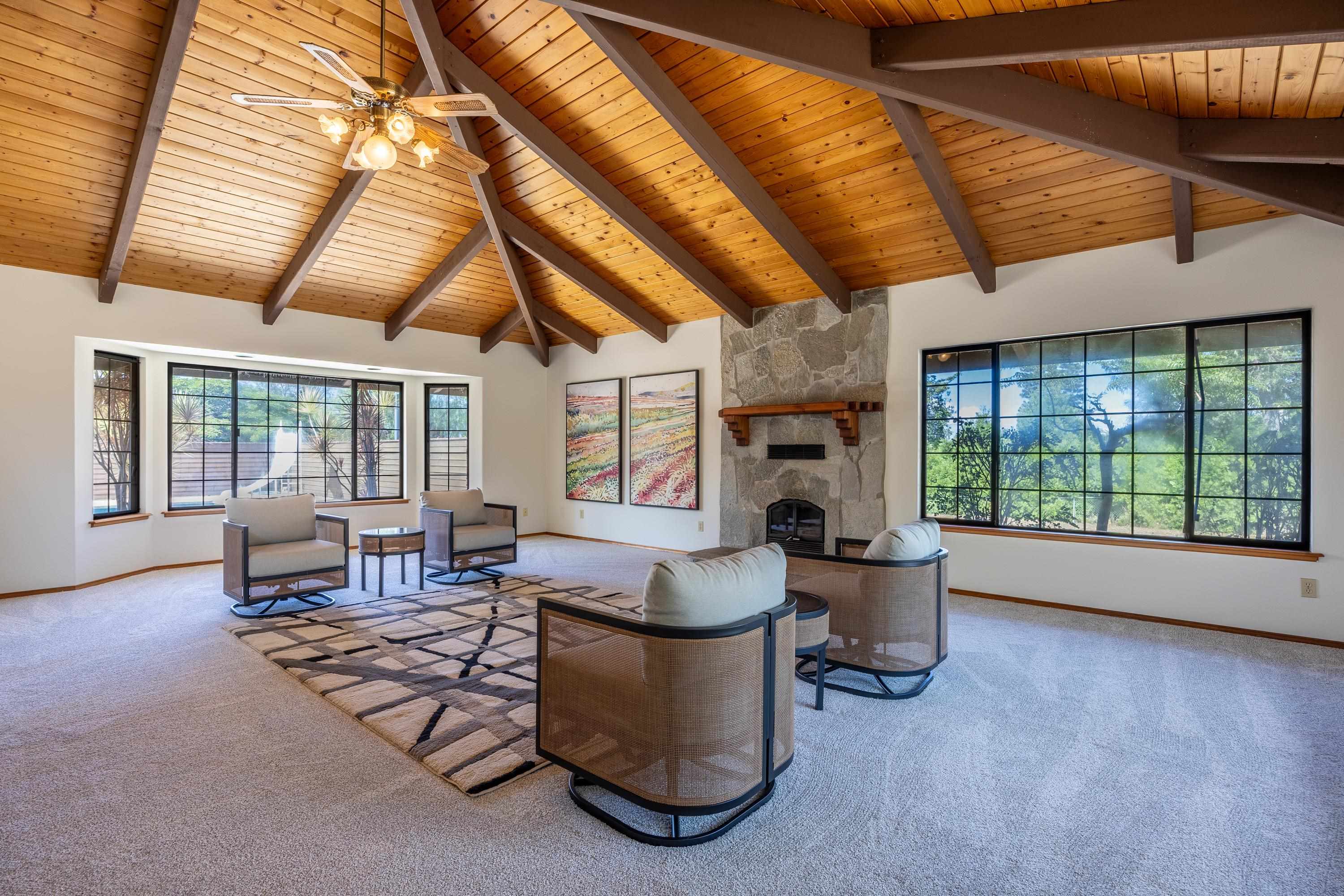 128 Hoopalua Drive Makawao, HI 96768 - Photo 8 of 50 a living room with furniture and large windows