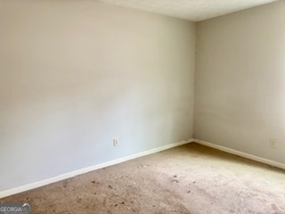 6460 Connell Road Atlanta, GA 30349 - Photo 11 of 21 an empty room with a bench