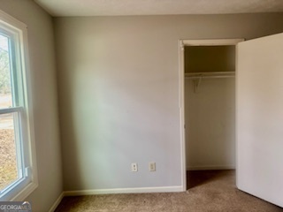 6460 Connell Road Atlanta, GA 30349 - Photo 12 of 21 a view of an empty room with a window