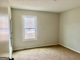 6460 Connell Road Atlanta, GA 30349 - Photo 14 of 21 an empty room with a window
