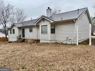 6460 Connell Road Atlanta, GA 30349 - Photo 21 of 21 a view of a house with a yard