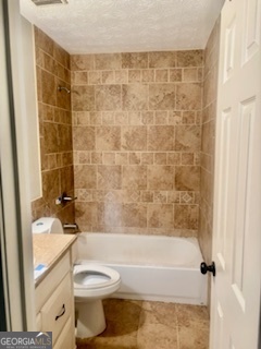 6460 Connell Road Atlanta, GA 30349 - Photo 9 of 21 a bathroom with a toilet and a bathtub