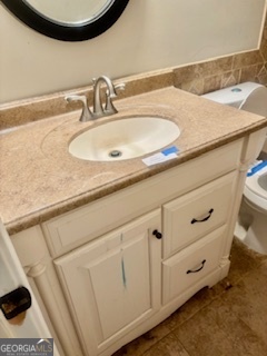 6460 Connell Road Atlanta, GA 30349 - Photo 10 of 21 a bathroom with a sink and a mirror
