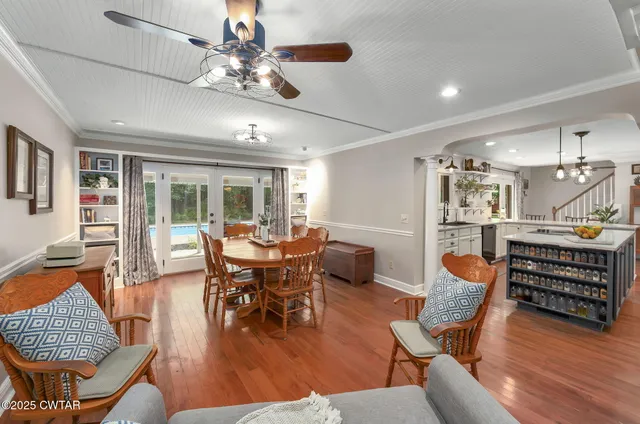 a outdoor space with lots of chairs and a chandelier