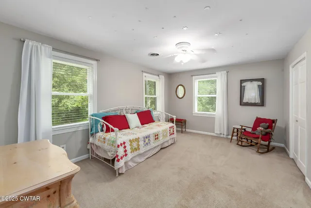 a living room with furniture and windows