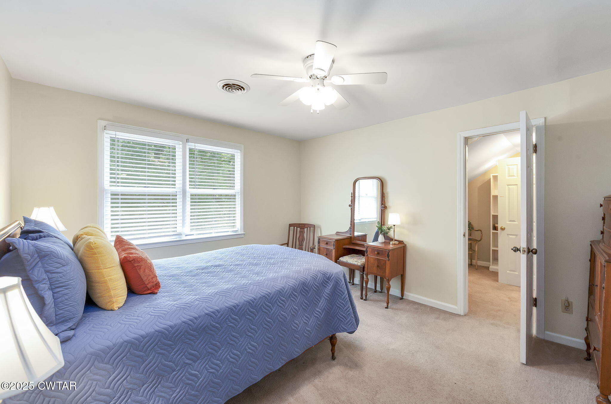 114 Old Stage Road Jackson, TN 38305 - Photo 29 of 50 a bedroom with a bed and a chandelier