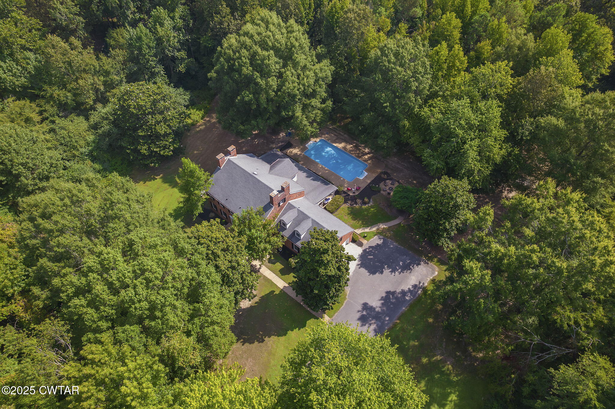 114 Old Stage Road Jackson, TN 38305 - Photo 3 of 50 an aerial view of a house with outdoor space and trees all around