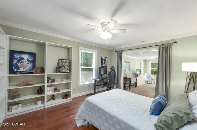 a bedroom with furniture and a chandelier