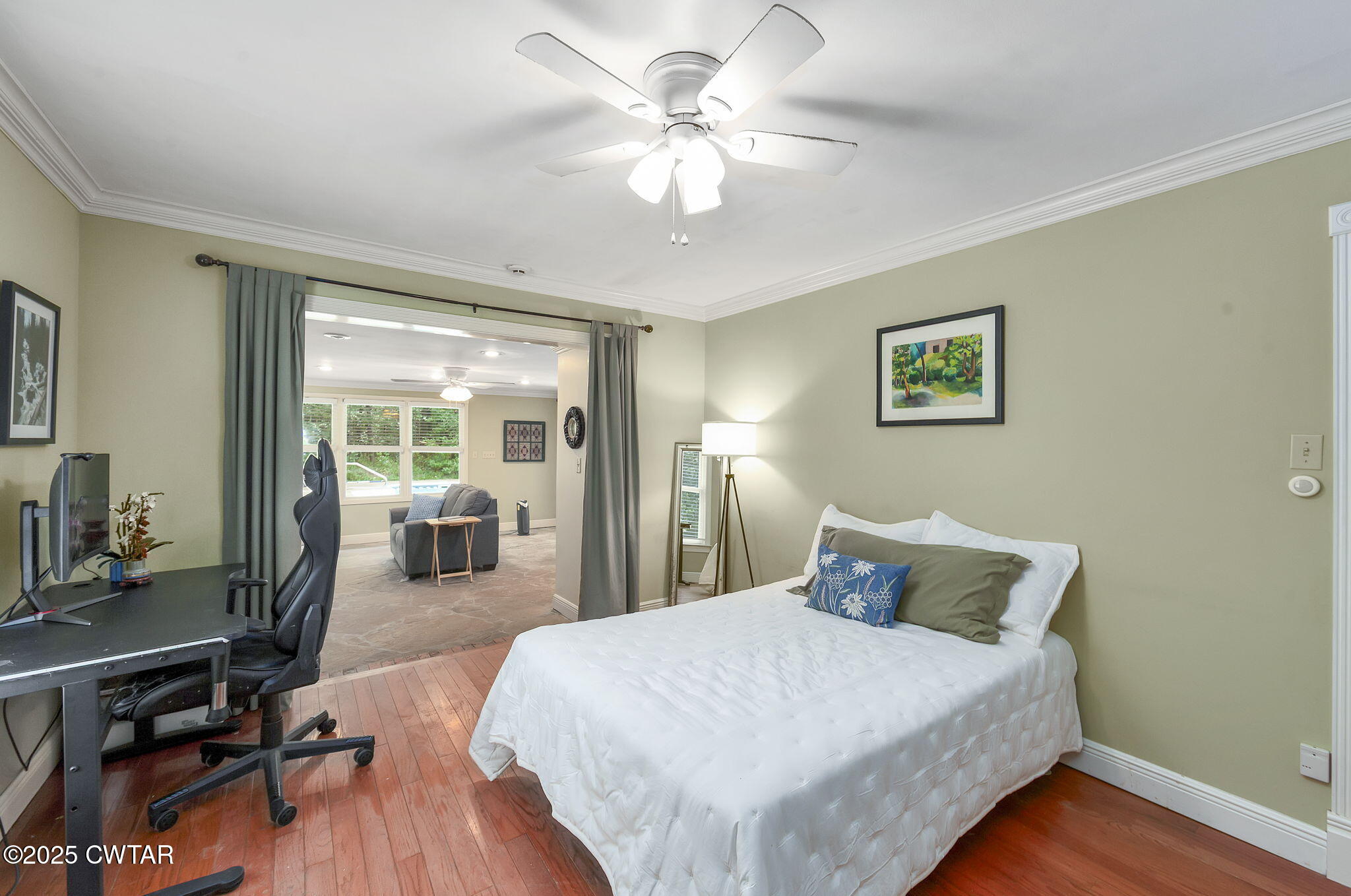 114 Old Stage Road Jackson, TN 38305 - Photo 32 of 50 a spacious bedroom with a bed and a chandelier