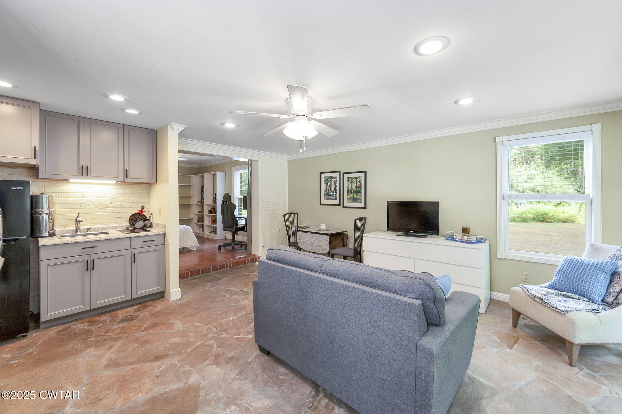 114 Old Stage Road Jackson, TN 38305 - Photo 33 of 50 a living room with furniture and a flat screen tv