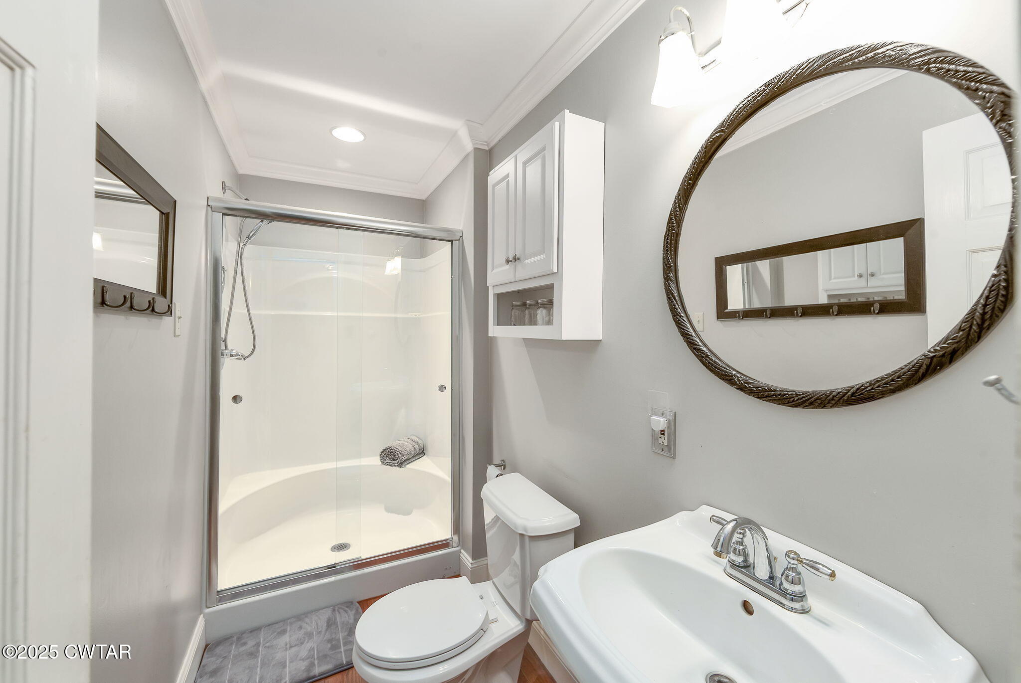 114 Old Stage Road Jackson, TN 38305 - Photo 36 of 50 a bathroom with a toilet sink and a mirror