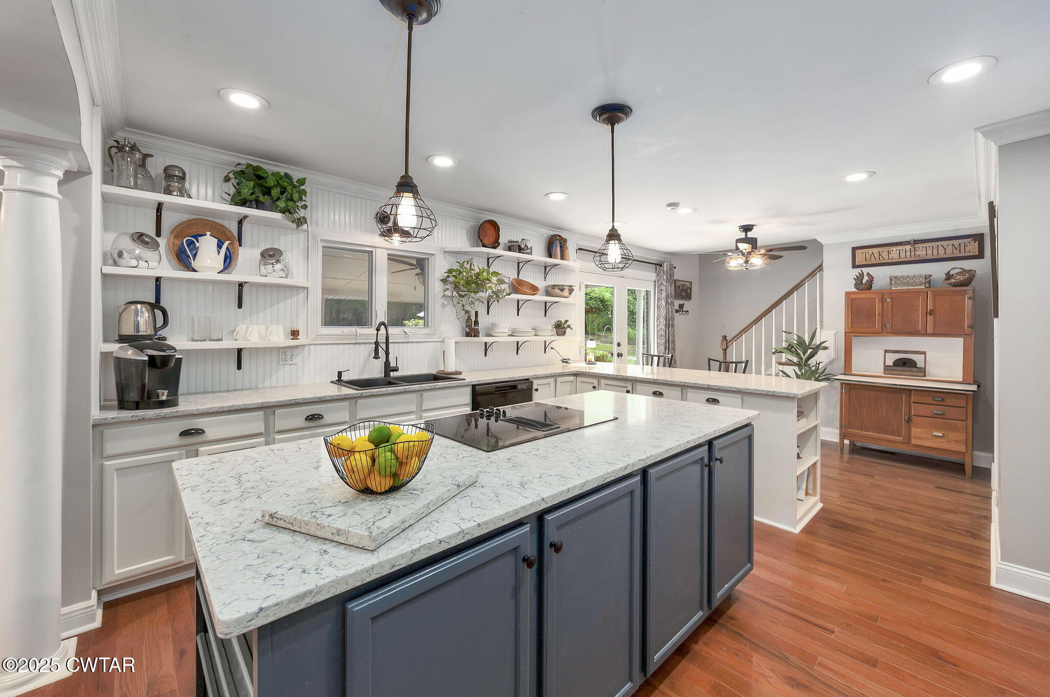 114 Old Stage Road Jackson, TN 38305 - Photo 7 of 50 a kitchen with stainless steel appliances granite countertop a sink a counter space and wooden floor