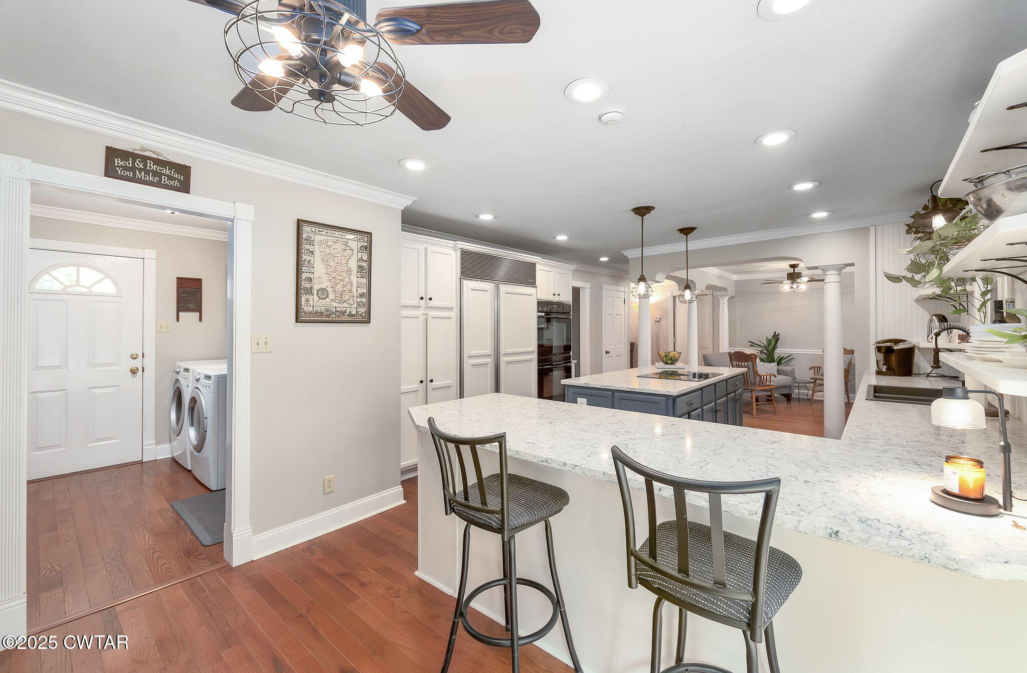 114 Old Stage Road Jackson, TN 38305 - Photo 8 of 50 a dining room with wooden floor and a chandelier