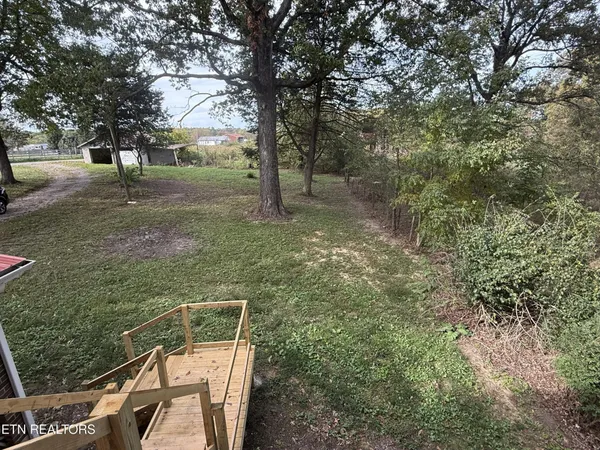 a backyard of a house with lots of green space