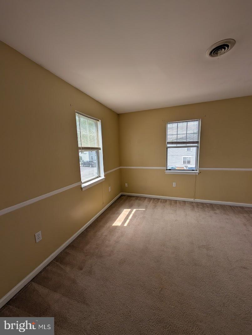 859 Old Silver Springs Road Mechanicsburg, PA 17055 - Photo 12 of 28 an empty room with windows and closet