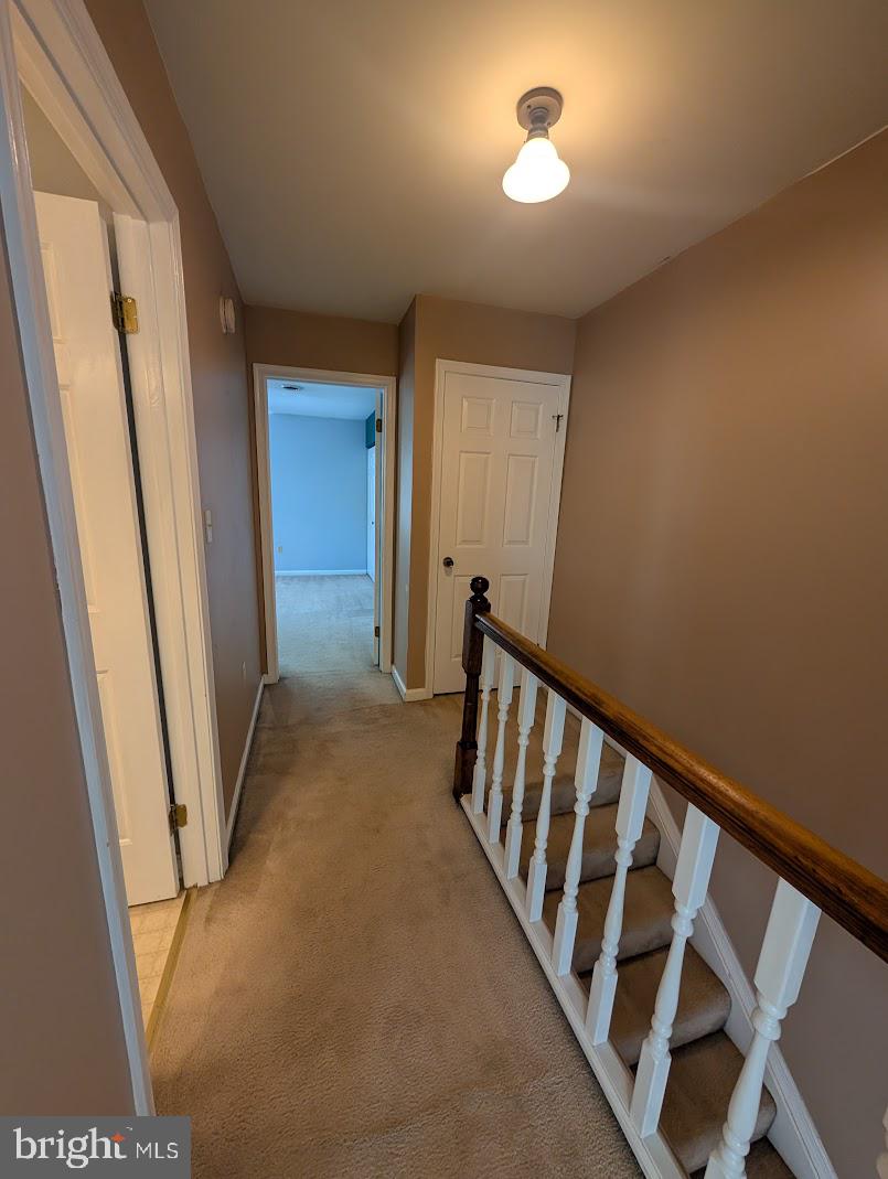 859 Old Silver Springs Road Mechanicsburg, PA 17055 - Photo 14 of 28 a view of a hallway with staircase