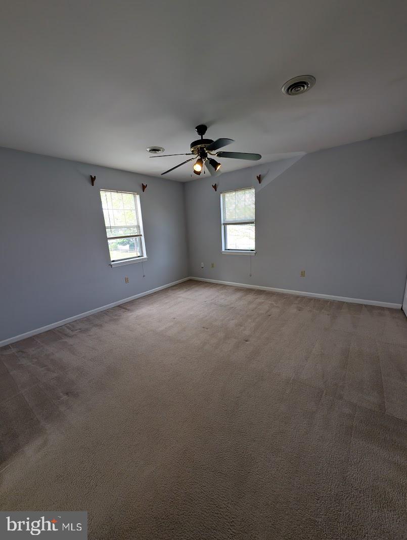 859 Old Silver Springs Road Mechanicsburg, PA 17055 - Photo 17 of 28 a view of a livingroom with a ceiling fan and window