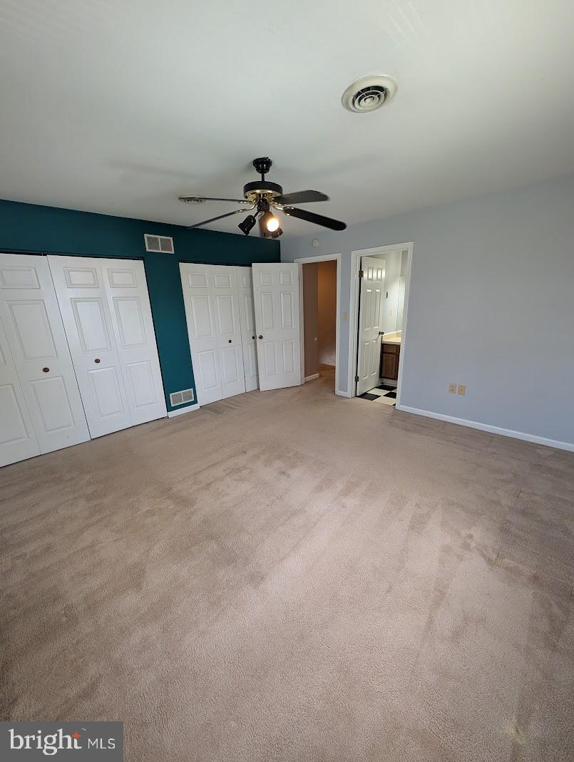 859 Old Silver Springs Road Mechanicsburg, PA 17055 - Photo 19 of 28 a view of a livingroom with a ceiling fan