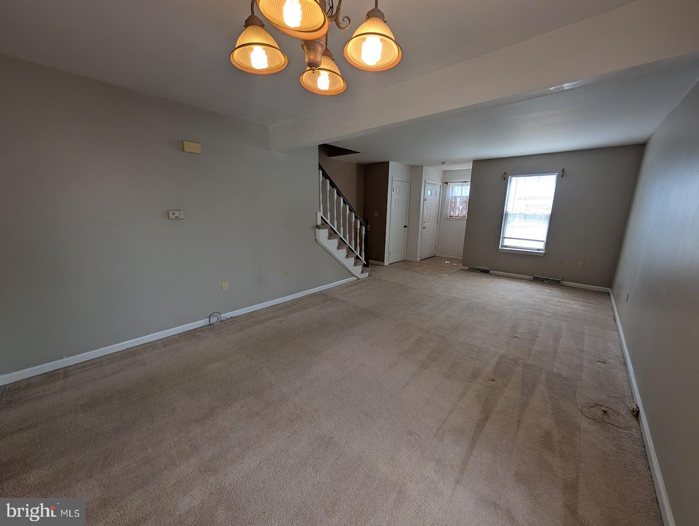 859 Old Silver Springs Road Mechanicsburg, PA 17055 - Photo 5 of 28 an empty room with wooden floor and windows