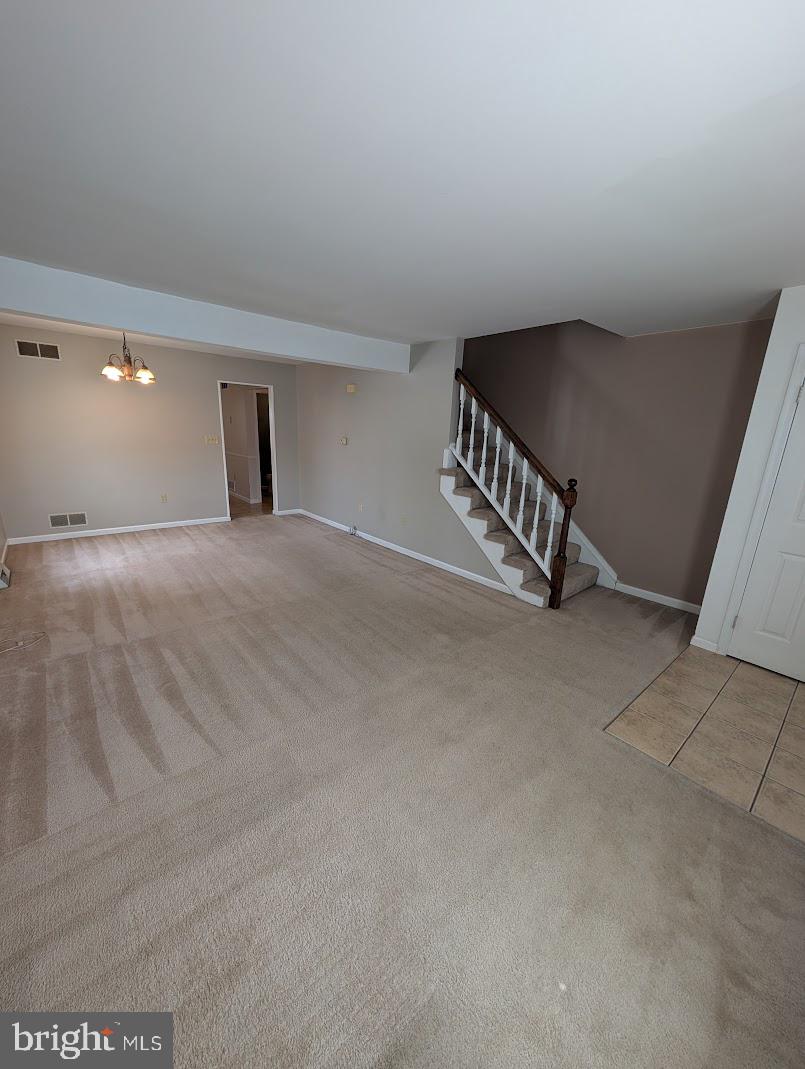 859 Old Silver Springs Road Mechanicsburg, PA 17055 - Photo 6 of 28 a view of an empty room with stairs and a window