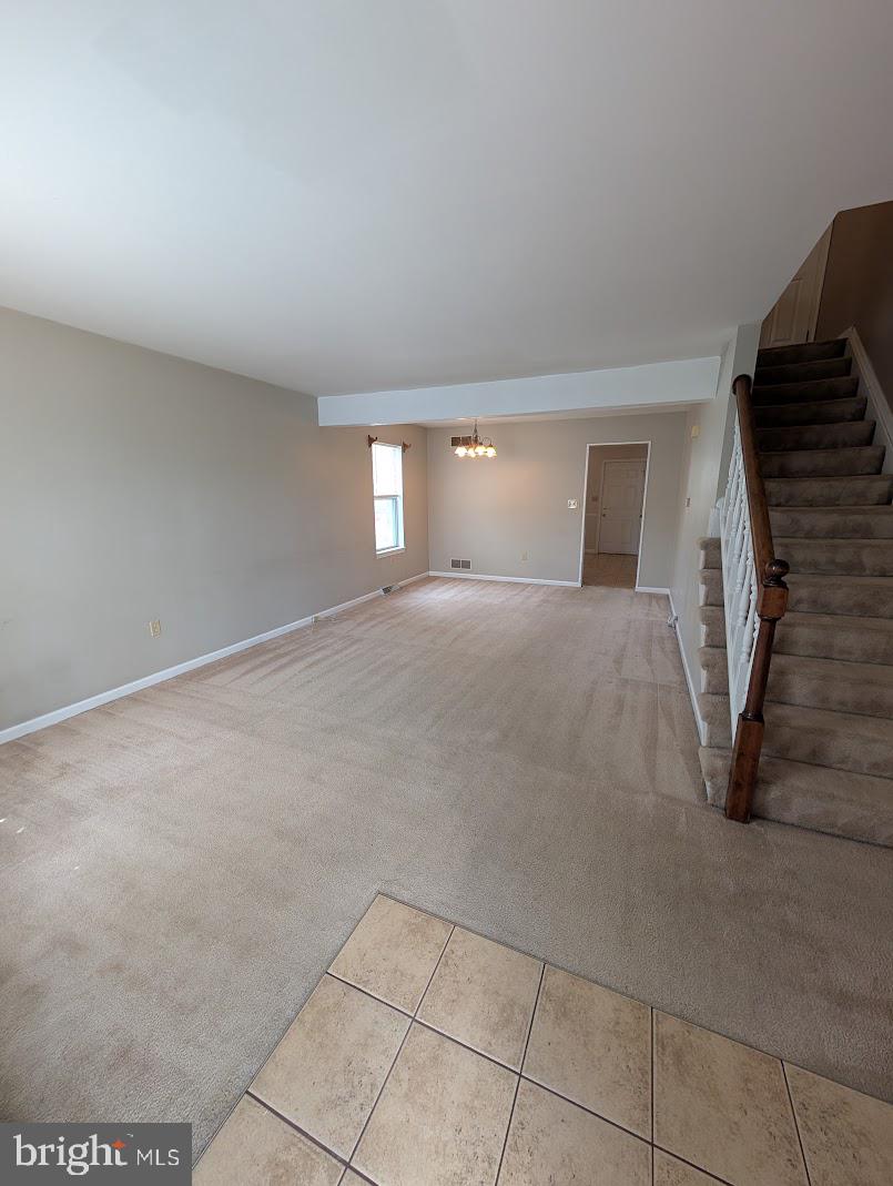 859 Old Silver Springs Road Mechanicsburg, PA 17055 - Photo 7 of 28 a view of a livingroom with a staircase